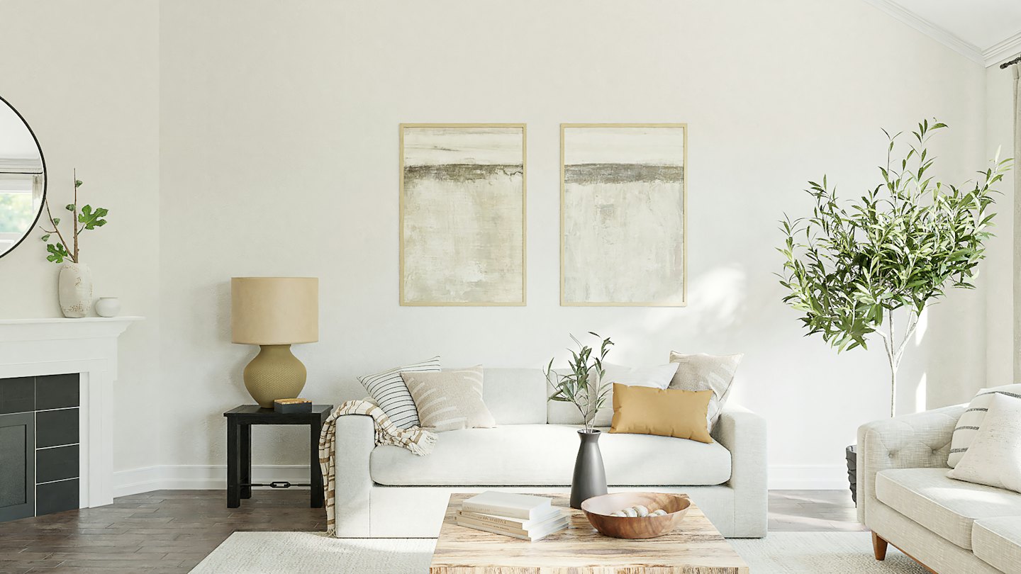 Modern living room with white sofa and abstract art.
